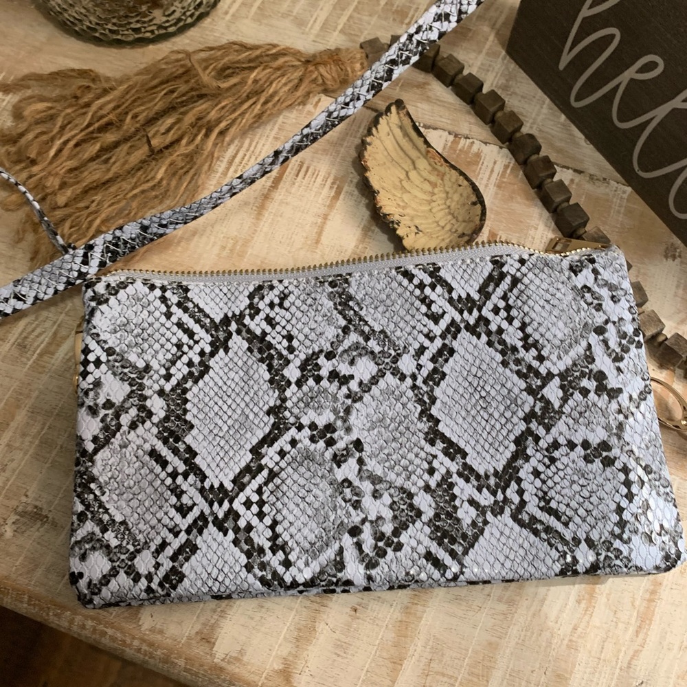 Caroline Hill. Light blue/black snake print cross body/clutch purse.